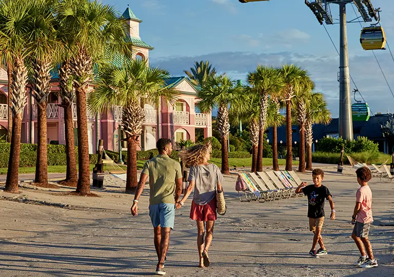 Family walking on the side walk at Disney's Caribbean Beach Resort