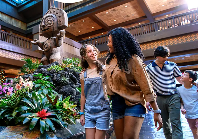 Family walking inside of Disney's Polynesian Village Resort