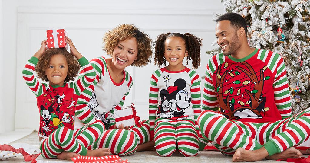 Family dressed in Disney sleepwear on a holiday morning