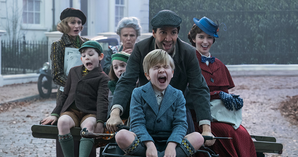 Mary Poppins and Banks family riding down the street