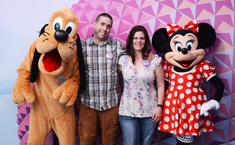 couple with Disney Minnie and Pluto at Epcot