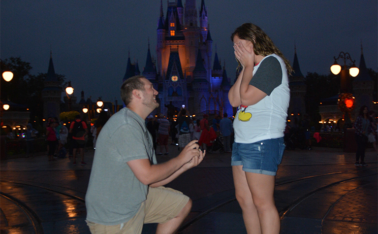 disney marriage proposal in front of castle