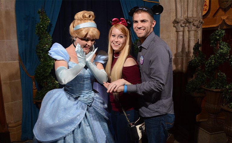 couple taking photo with Cinderella