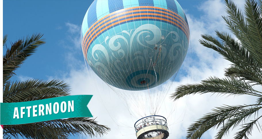 Character in flight balloon over Disney Springs