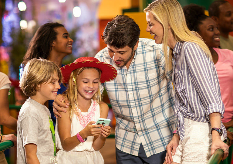 Family looking at phone together