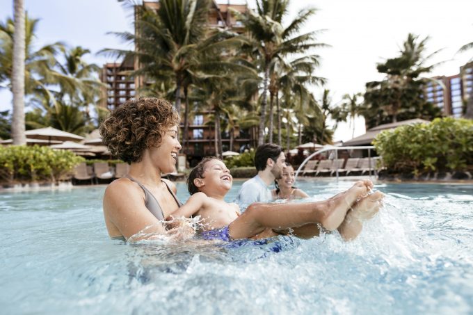 Mother and son playing in the pool