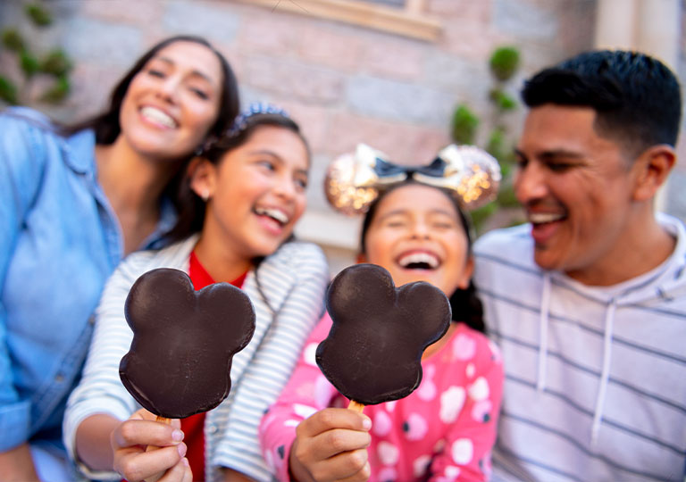 Family snacking on Mickey Ice Cream bars