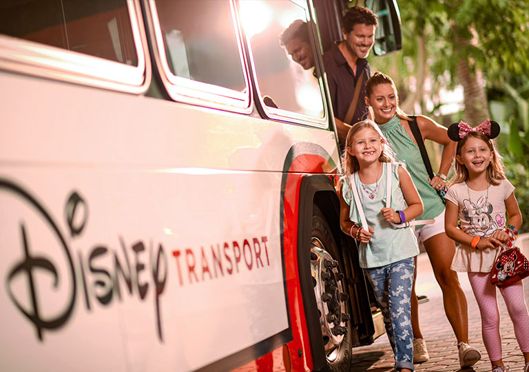 Family getting off of Disney Transportation bus