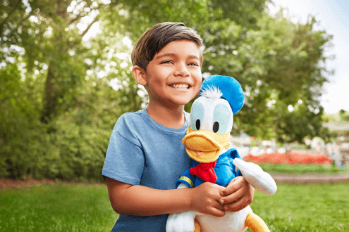 Kid with Donald Duck Plush