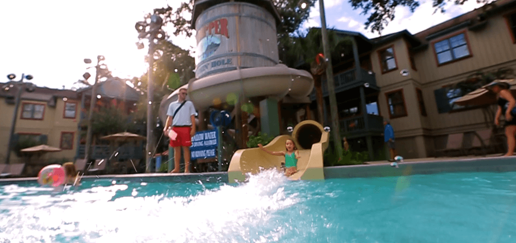 Girl sliding down water slide