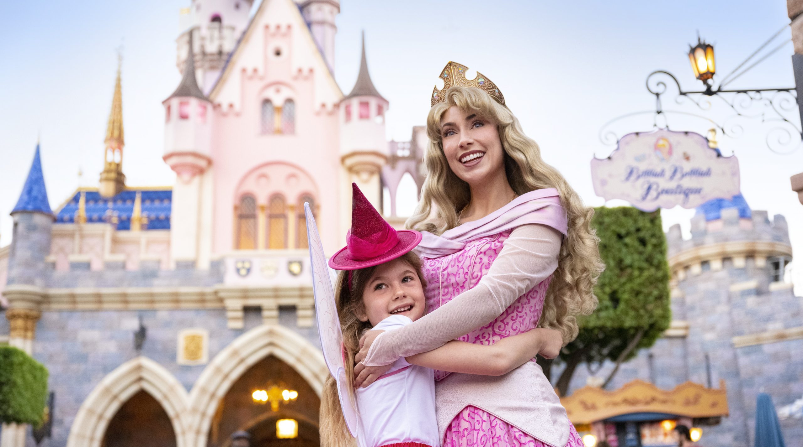 Little girl hugging princess