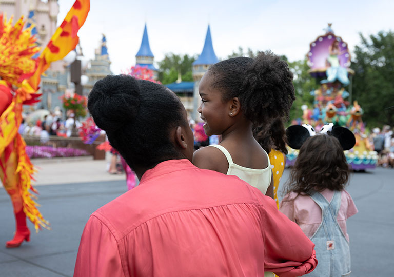 Mom and daughter watching a parade