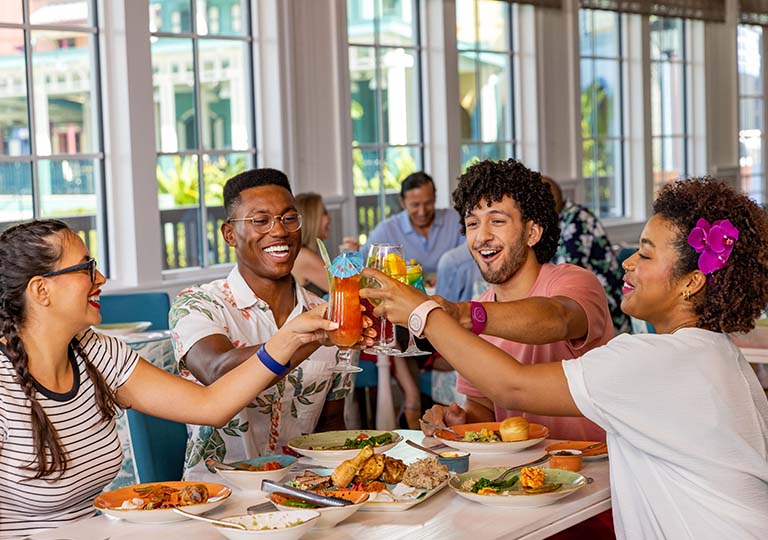 Group of friends cheer with drinks