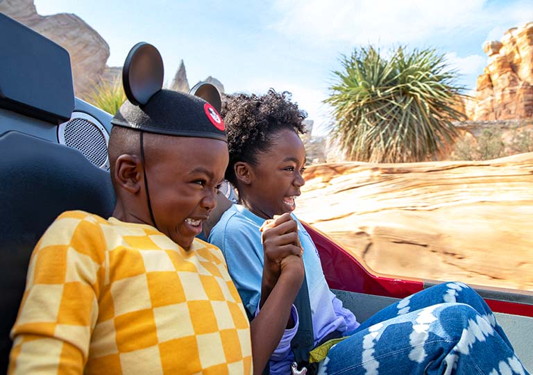 Kids riding a roller coaster 