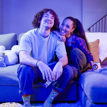 Couple at home watching TV