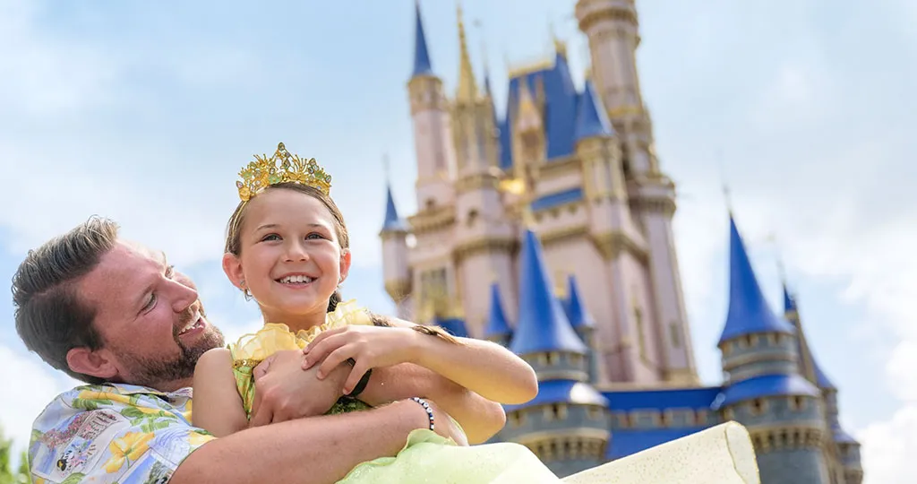 Father and daughter in front of castle