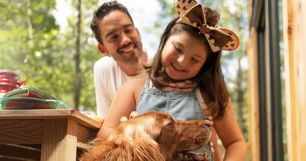 Dad with girl and dog