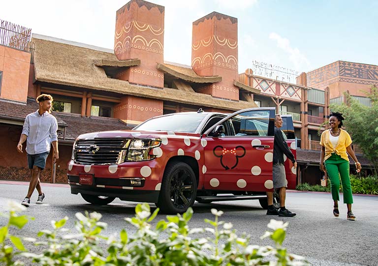 Guests riding the Minnie Van