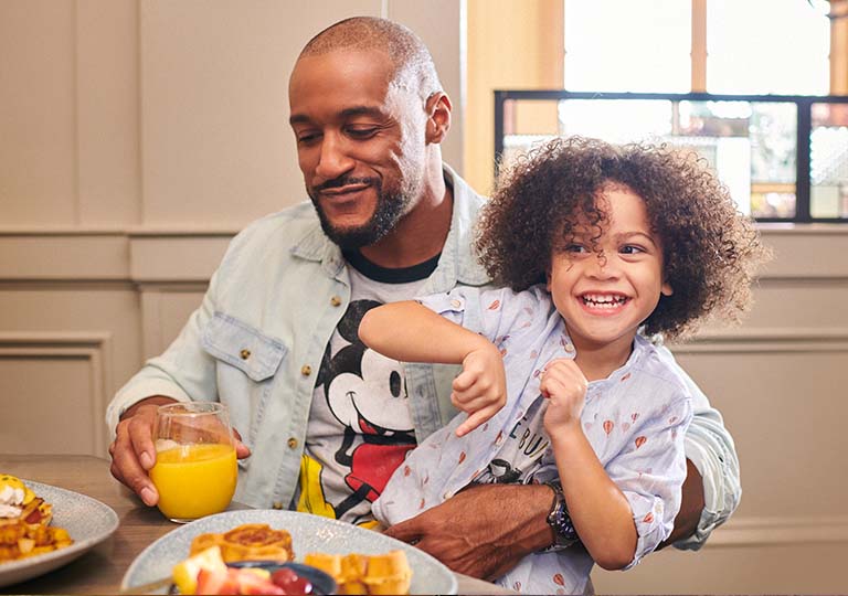 Father and son eating breakfast