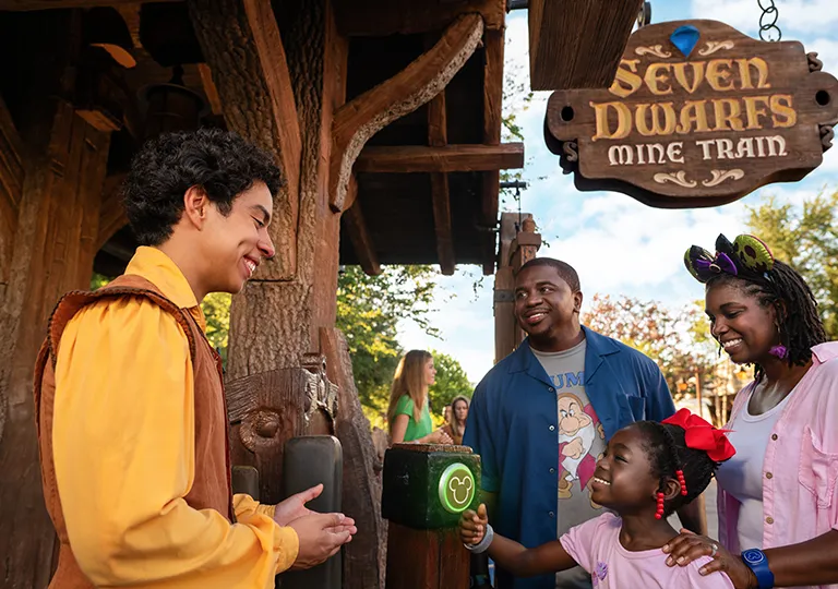 Family entering Seven Dwarfs Mine Train