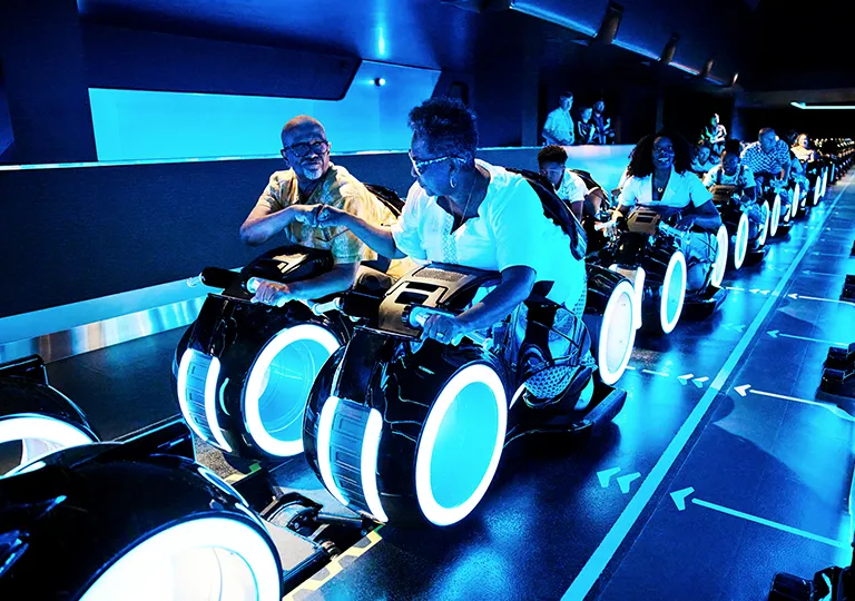Guests riding Tron attraction