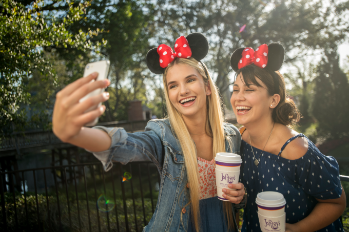Girls taking selfie with Minnie Mouse Ears and Joffrey's cups