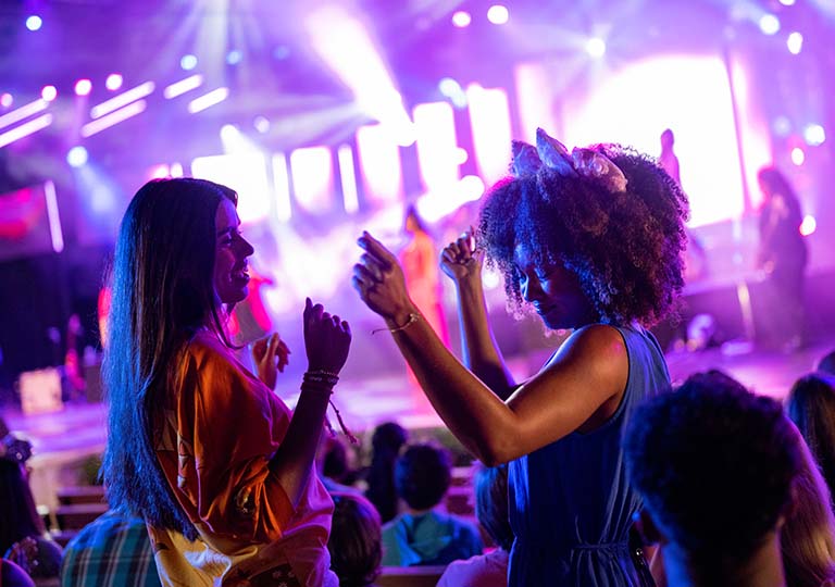 Women dancing at Garden Rocks Concert
