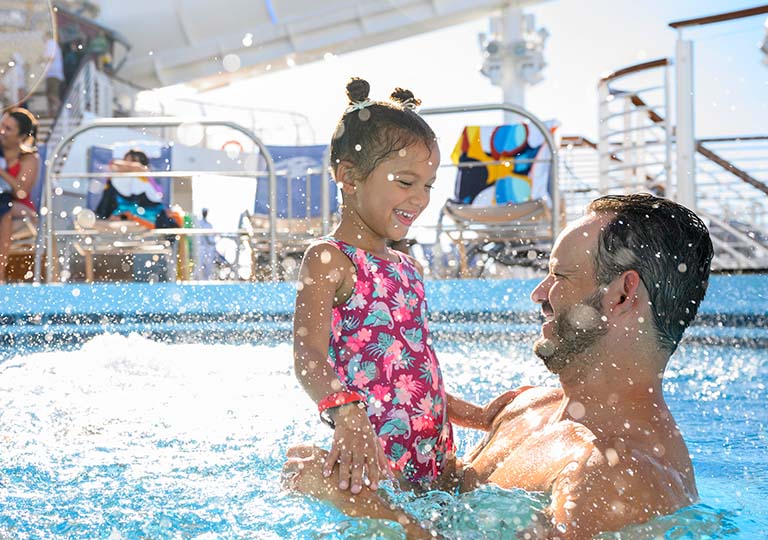 Father and daughter in pool
