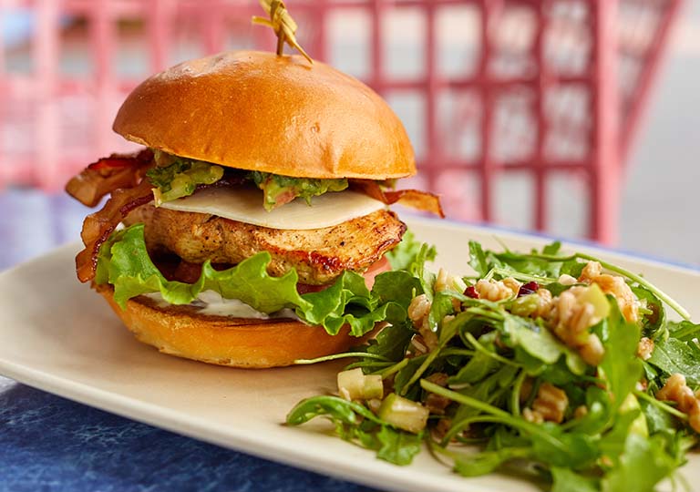 burger with salad at ABC Commissary 