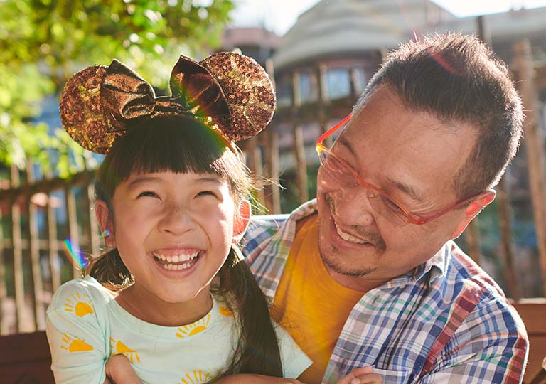Dad and daughter smiling