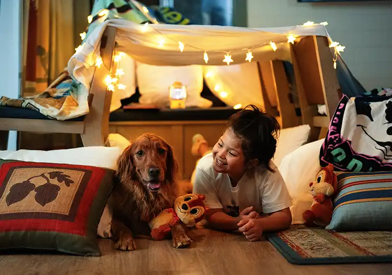 Girl and dog in room