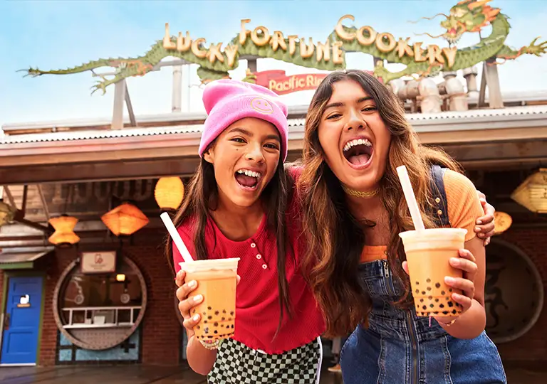 Girls in front of Lucky Fortune Cookery