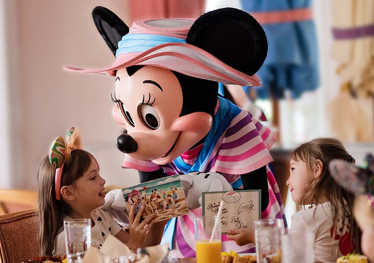 Minnie Mouse interacting with kid