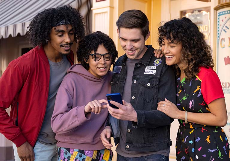 Friends looking at phone