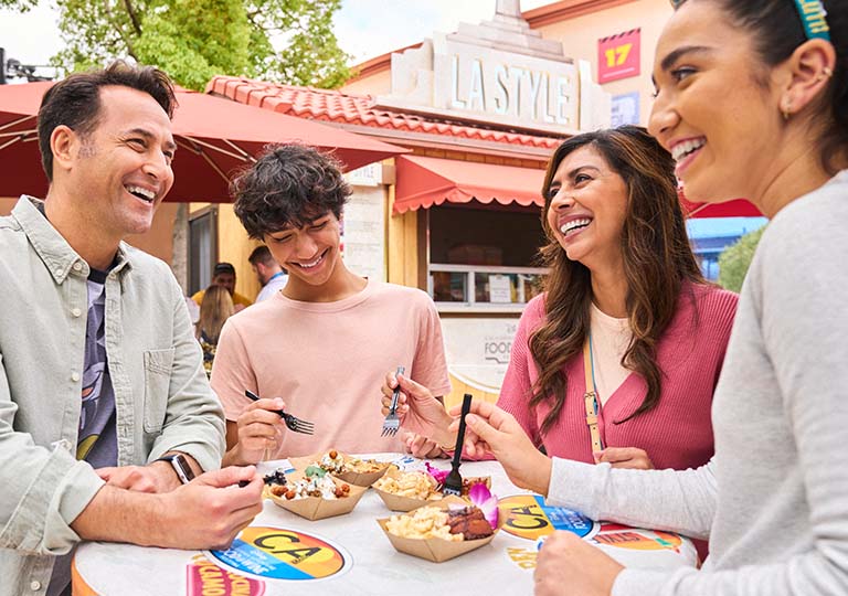 Family eating food at Food & Wine Festival