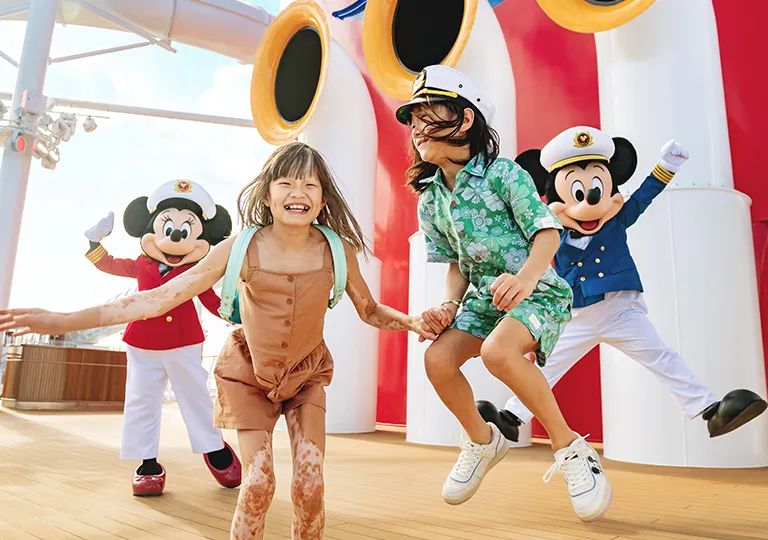 Guests with Mickey Mouse and Minnie Mouse on Disney Cruise Line
