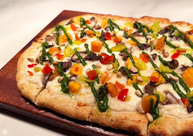 Pizza-like light bite: Seasonal Market Vegetables Flatbread at Ale & Compass Lounge