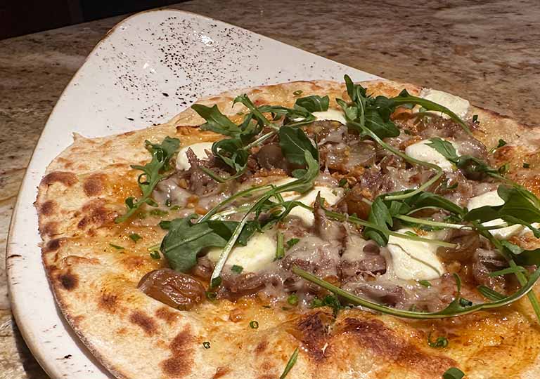 Fancy pizza: Duck Confit and Honey-Raisin Flatbread at Jiko &ndash; The Cooking Place