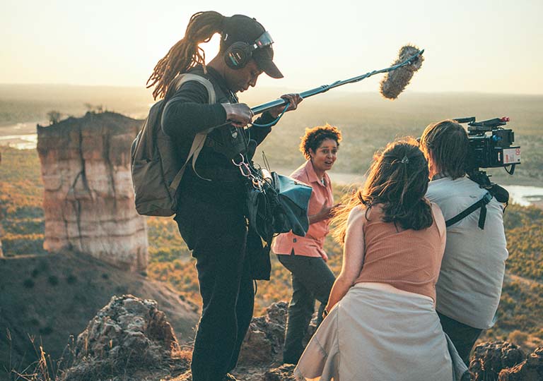 Camera crew filming Dr. Kahumbu