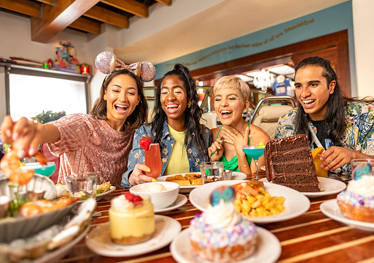Group of friends dining at The Boathouse Walt Disney Worth fiftieth celebration