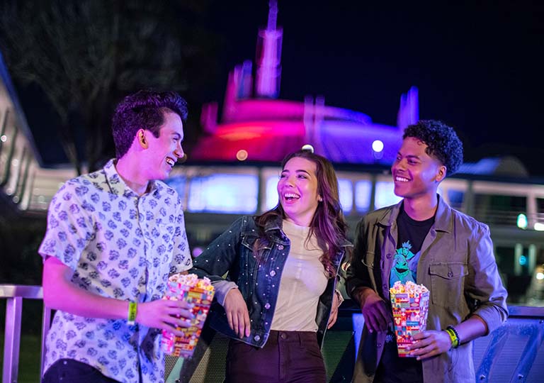 Friends standing in front of Space Mountain&reg;