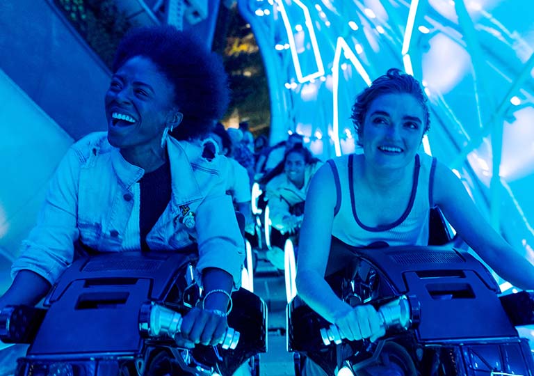 Guests riding TRON Lightcycle / Run presented by Enterprise