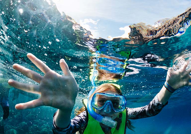 Kid snorkeling in the Galapagos Islands Expedition Cruise