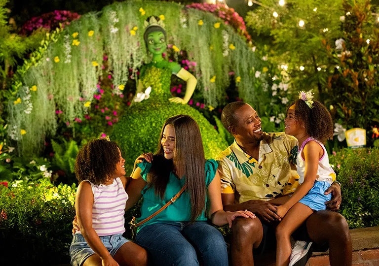 Family sitting together at the EPCOT International Flower & Garden Festival