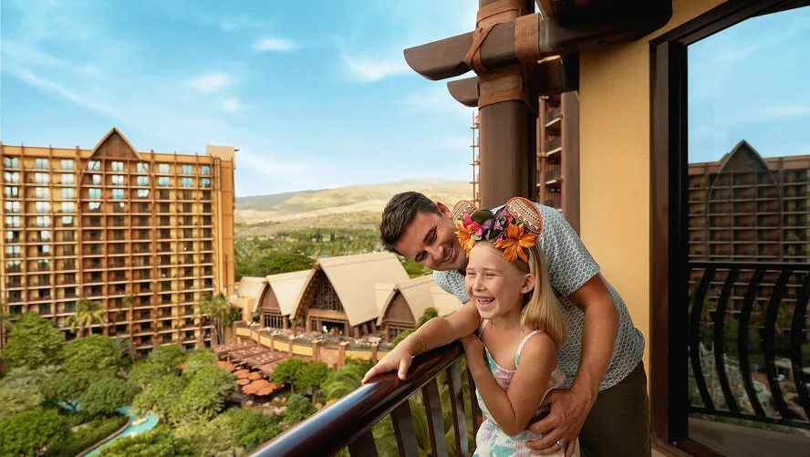 Disney dad and daughter enjoying the balcony view at Aulani, A Disney Resort & Spa in Ko Olina, Hawaiʻi.