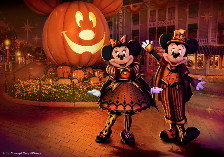 Mickey Mouse and Minnie Mouse in front of Mickey Mouse Pumpkin