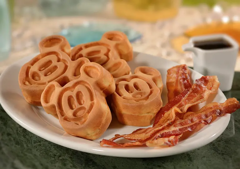 Mickey-Shaped Waffles with a side of bacon